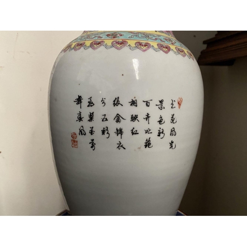 22 - A LARGE 20TH CENTURY CHINESE FAMILLE ROSE PORCELAIN VASE, of baluster form, decorated with painted s... 