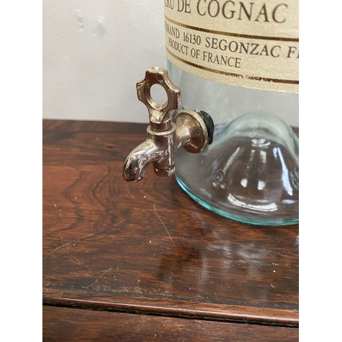 228 - A VINTAGE PIERRE FERRAND COGNAC DISPENSER ON STAND, three litre bottle with original labels, central... 