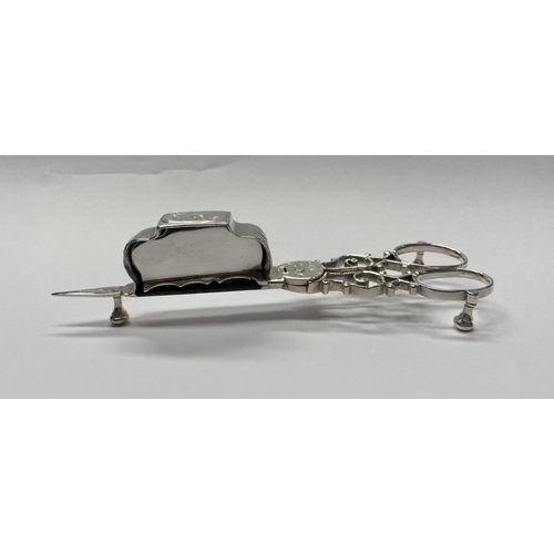 23 - A GEORGE III SILVER CANDLE SNUFFER, Maker John Booth, London, 1767. With oval handles and attached r... 