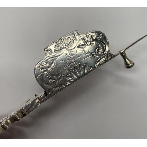 23 - A GEORGE III SILVER CANDLE SNUFFER, Maker John Booth, London, 1767. With oval handles and attached r... 