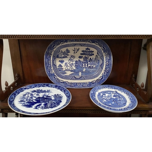 230 - THREE BLUE AND WHITE SERVING DISHES, one Copland, each finely decorated in the Blue Willow pattern; ... 