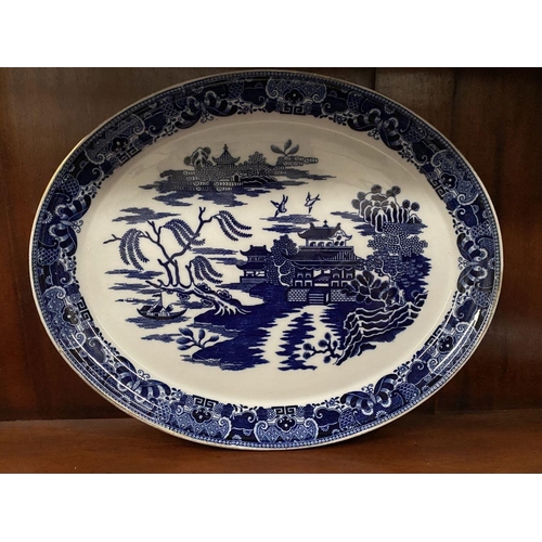 230 - THREE BLUE AND WHITE SERVING DISHES, one Copland, each finely decorated in the Blue Willow pattern; ... 