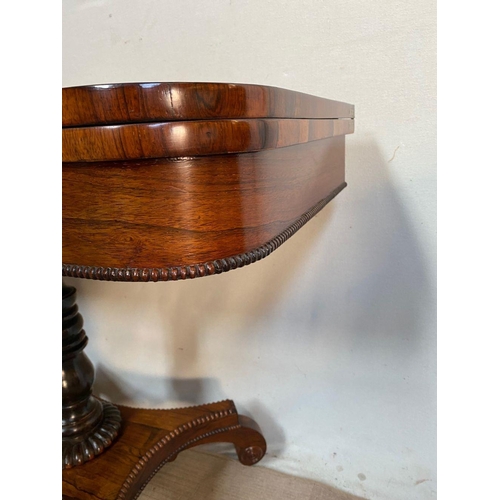 25 - A REGENCY ROSEWOOD CARD TABLE, with crossbanding to top, decorative brass inlay to frieze, opening t... 