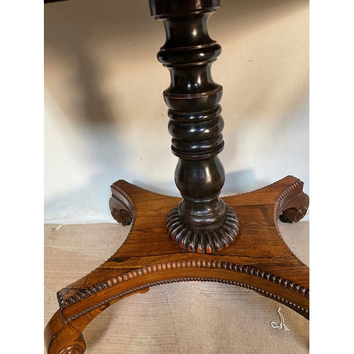 25 - A REGENCY ROSEWOOD CARD TABLE, with crossbanding to top, decorative brass inlay to frieze, opening t... 