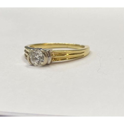 28 - A BEAUTIFUL 18CT TWO TONE GOLD DIAMOND SOLITAIRE RING, round brilliant cut diamond, in ornate half b... 