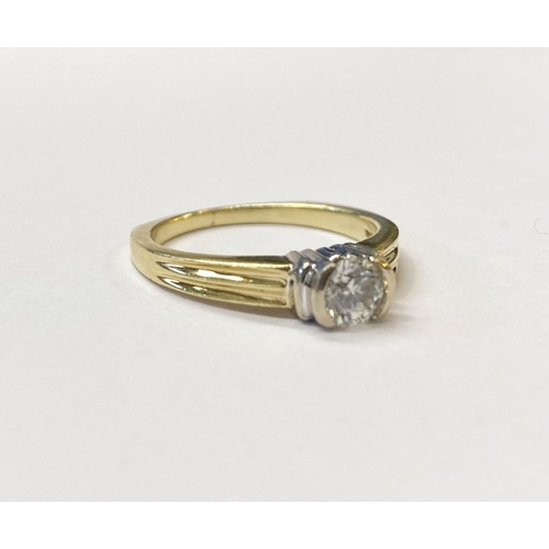 28 - A BEAUTIFUL 18CT TWO TONE GOLD DIAMOND SOLITAIRE RING, round brilliant cut diamond, in ornate half b... 