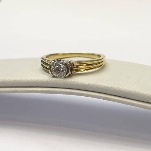 28 - A BEAUTIFUL 18CT TWO TONE GOLD DIAMOND SOLITAIRE RING, round brilliant cut diamond, in ornate half b... 