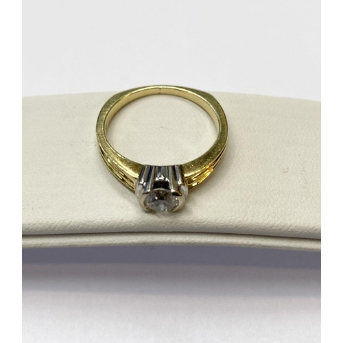 28 - A BEAUTIFUL 18CT TWO TONE GOLD DIAMOND SOLITAIRE RING, round brilliant cut diamond, in ornate half b... 