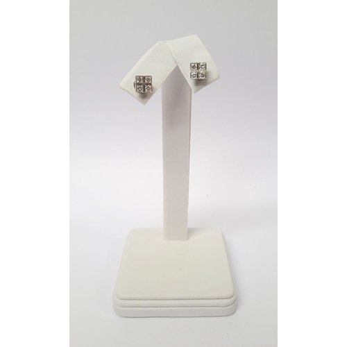 31 - A GEORGEOUS CASED PAIR OF CARTIER DIAMOND CLUSTER STUD EARRINGS, each with four brilliant cut diamon... 