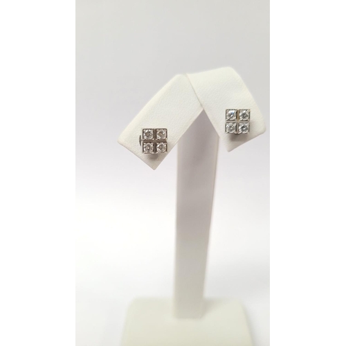 31 - A GEORGEOUS CASED PAIR OF CARTIER DIAMOND CLUSTER STUD EARRINGS, each with four brilliant cut diamon... 