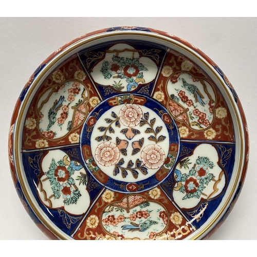 33 - A VINTAGE JAPANESE IMARI PLATTER, hand painted in vibrant imari patterns and colours, with circular ... 