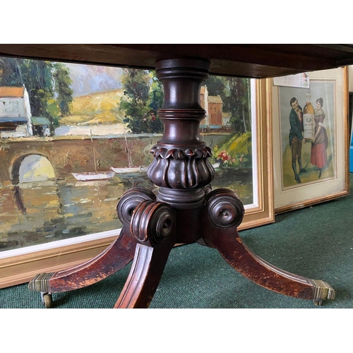 34 - A REGENCY MAHOGANY FOLD-OVER TEA TABLE, with raised carving and beading to the frieze above turned a... 