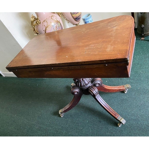 34 - A REGENCY MAHOGANY FOLD-OVER TEA TABLE, with raised carving and beading to the frieze above turned a... 