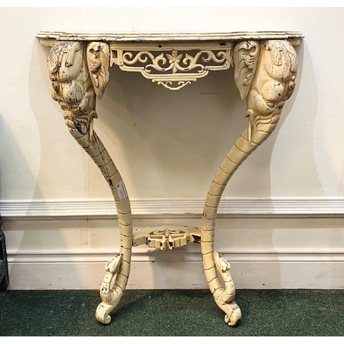 35 - AN ELEPHANTINE PAINTED ROCOCO CONSOLE TABLE bevelled top, with floral fretwork on the frieze; distin... 