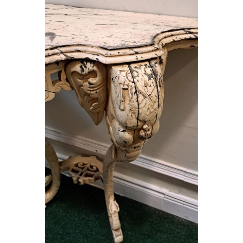 35 - AN ELEPHANTINE PAINTED ROCOCO CONSOLE TABLE bevelled top, with floral fretwork on the frieze; distin... 