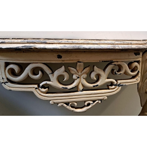 35 - AN ELEPHANTINE PAINTED ROCOCO CONSOLE TABLE bevelled top, with floral fretwork on the frieze; distin... 