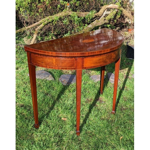 4 - AN EXCELLENT GEORGE III MAHOGANY DEMI LUNE CARD TABLE, having crossbanded top with marquetry fan dec... 