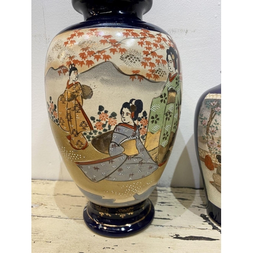 47 - THREE GRADUATED 20TH CENTURY SATSUMA VASES, each with gilded decoration on painted panels depicting ... 