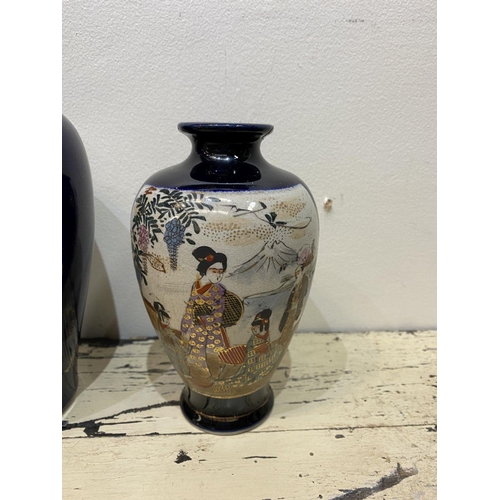 47 - THREE GRADUATED 20TH CENTURY SATSUMA VASES, each with gilded decoration on painted panels depicting ... 