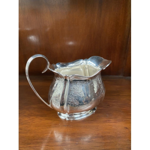 5 - AN SUBSTANTIAL GEORGE V SILVER TEA SERVICE, to include teapot, sugar bowl and milk jug, Maker Atkin ... 