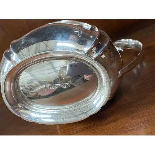 5 - AN SUBSTANTIAL GEORGE V SILVER TEA SERVICE, to include teapot, sugar bowl and milk jug, Maker Atkin ... 