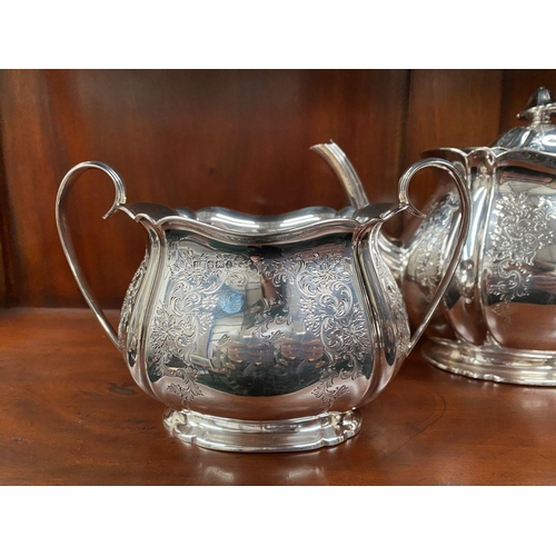 5 - AN SUBSTANTIAL GEORGE V SILVER TEA SERVICE, to include teapot, sugar bowl and milk jug, Maker Atkin ... 