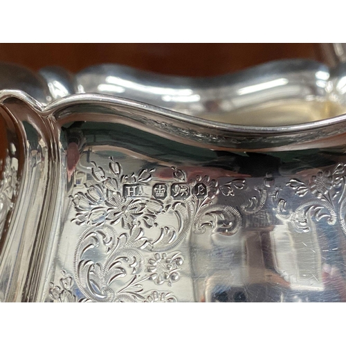 5 - AN SUBSTANTIAL GEORGE V SILVER TEA SERVICE, to include teapot, sugar bowl and milk jug, Maker Atkin ... 