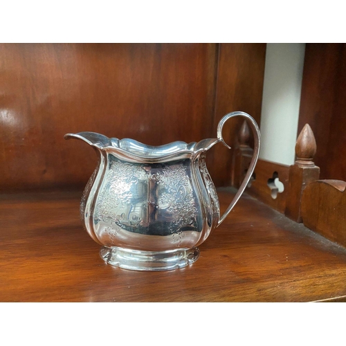 5 - AN SUBSTANTIAL GEORGE V SILVER TEA SERVICE, to include teapot, sugar bowl and milk jug, Maker Atkin ... 