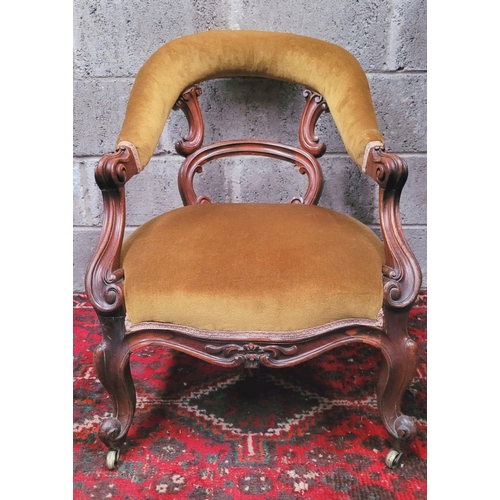 56 - A GOOD QUALITY 19TH CENTURY CARVED LOW RISE OPEN ARMCHAIR, with curved padded crest rail that runs d... 