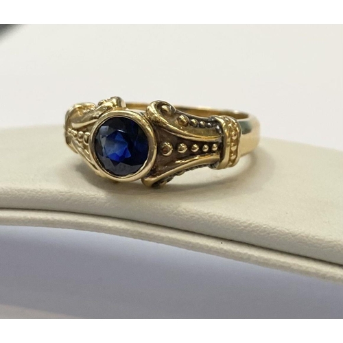 59 - A 14CT YELLOW GOLD ART NOUVEAU STYLE SAPPHIRE RING, Maker Adwar Casting, with the round brilliant cu... 