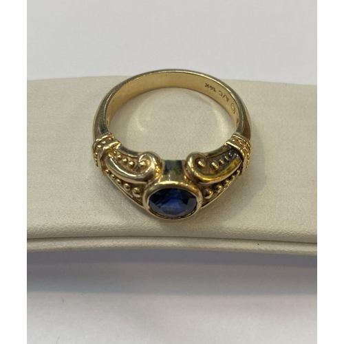 59 - A 14CT YELLOW GOLD ART NOUVEAU STYLE SAPPHIRE RING, Maker Adwar Casting, with the round brilliant cu... 