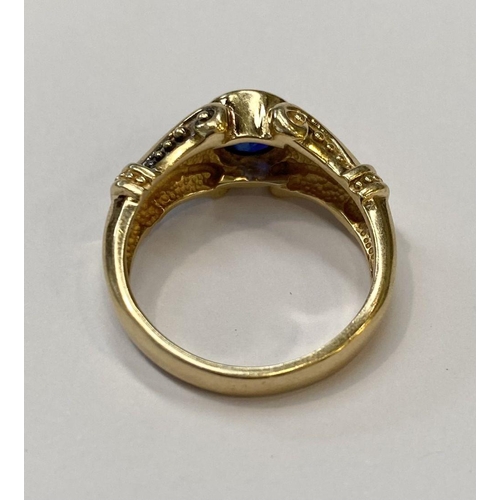 59 - A 14CT YELLOW GOLD ART NOUVEAU STYLE SAPPHIRE RING, Maker Adwar Casting, with the round brilliant cu... 