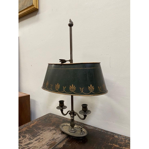 67 - AN EMPIRE STYLE BOUILLOTTE LAMP, in bronze with two scrolling branches topped by empire green tolewa... 