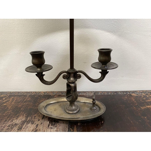 67 - AN EMPIRE STYLE BOUILLOTTE LAMP, in bronze with two scrolling branches topped by empire green tolewa... 