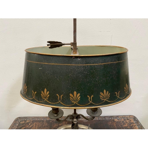 67 - AN EMPIRE STYLE BOUILLOTTE LAMP, in bronze with two scrolling branches topped by empire green tolewa... 