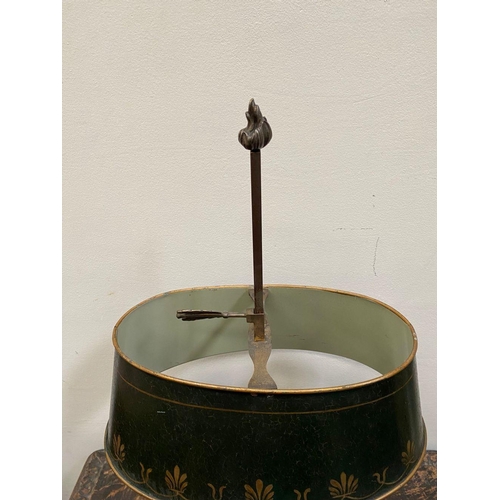 67 - AN EMPIRE STYLE BOUILLOTTE LAMP, in bronze with two scrolling branches topped by empire green tolewa... 