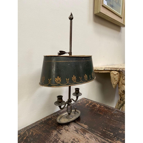 67 - AN EMPIRE STYLE BOUILLOTTE LAMP, in bronze with two scrolling branches topped by empire green tolewa... 