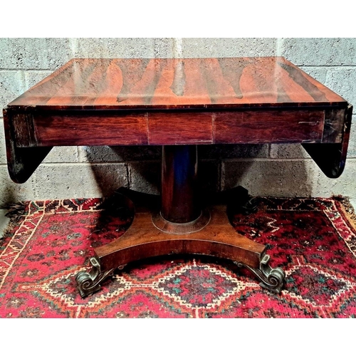 70 - A WILLIAM IV ROSEWOOD DROP-LEAF SOFA TABLE, 1810, base terminating in quadro-pod, standing on scroll... 