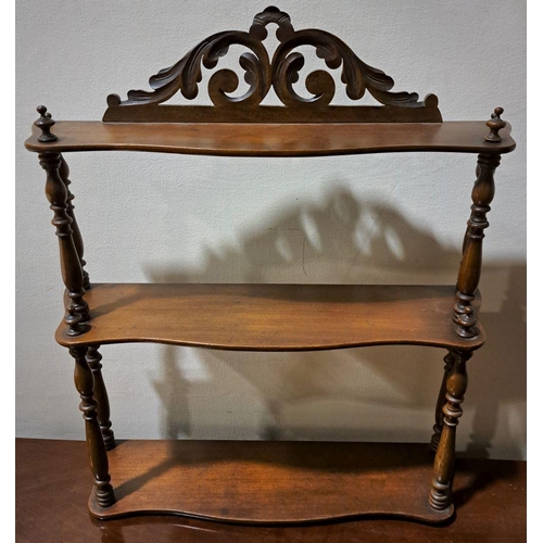 72 - A FLORAL VICTORIAN THREE-TIER MAHOGANY SPINDLE HANGING SHELF,  acanthus carving to the top, with spi... 