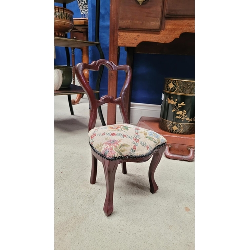 111 - A MINIATURE VINTAGE CARVED DINING CHAIR, with balloon shaped back, stuffed over seat with bead detai... 