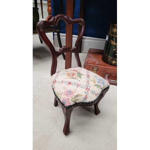 111 - A MINIATURE VINTAGE CARVED DINING CHAIR, with balloon shaped back, stuffed over seat with bead detai... 