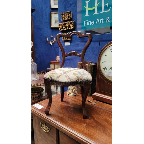 111 - A MINIATURE VINTAGE CARVED DINING CHAIR, with balloon shaped back, stuffed over seat with bead detai... 