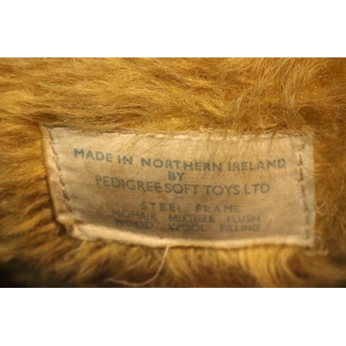 115 - AN EARLY 20TH CENTURY TOY DOG - PEDIGREE SOFT TOY LTD, made in Northern Ireland, with label beneath,... 