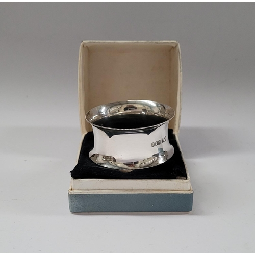 120 - THREE BOXED SILVER NAPKINS, (i) Boxed in a F. Brennan Patrick’s St. Box; an Irish silver napkin ring... 