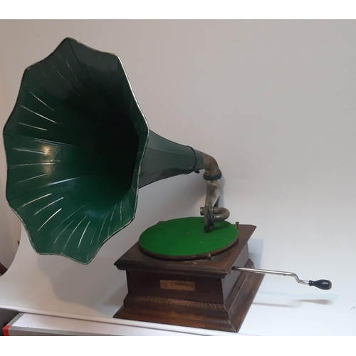 121 - A VINTAGE IRISH GRAMAPHONE, with original painted tin horn, a Dublin trade label attached. Measures ... 