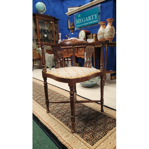 124 - AN EDWARDIAN MAHOGANY INLAID CORNER CHAIR, with raised crest rail decorated with marquetry inlay of ... 