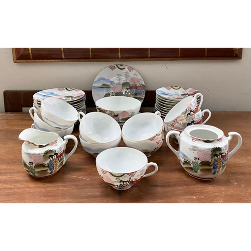 128 - A FINE VINTAGE JAPANESE HAND-PAINTED TEA SERVICE, to include 11 cups, 11 saucers, 12 side plates, 2 ... 