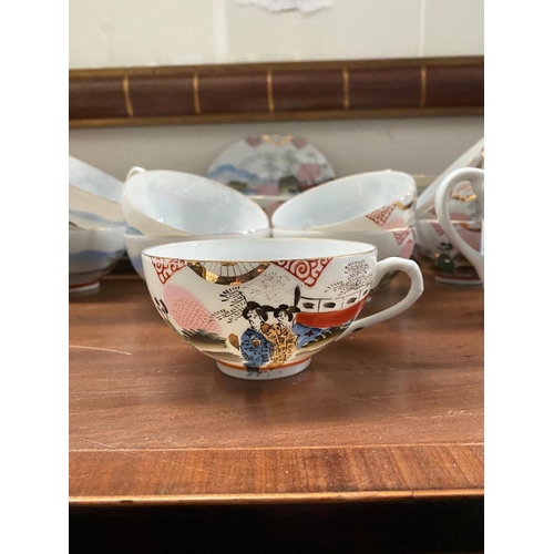 128 - A FINE VINTAGE JAPANESE HAND-PAINTED TEA SERVICE, to include 11 cups, 11 saucers, 12 side plates, 2 ... 