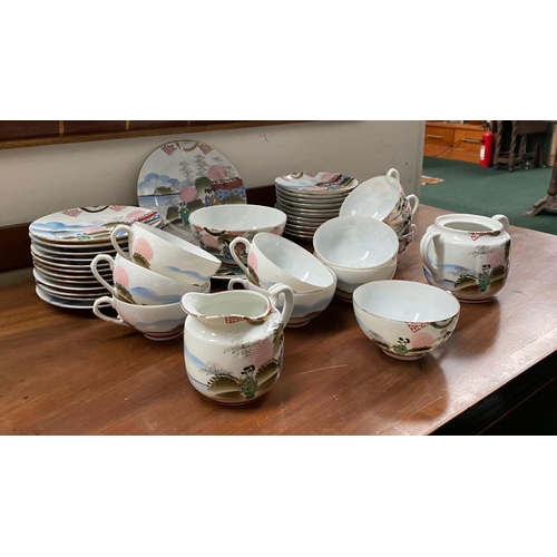 128 - A FINE VINTAGE JAPANESE HAND-PAINTED TEA SERVICE, to include 11 cups, 11 saucers, 12 side plates, 2 ... 