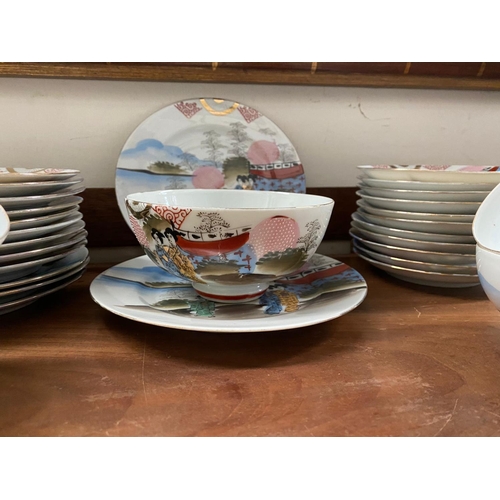 128 - A FINE VINTAGE JAPANESE HAND-PAINTED TEA SERVICE, to include 11 cups, 11 saucers, 12 side plates, 2 ... 